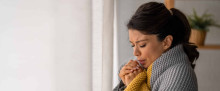 Cold woman in blanket